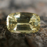 Cushion-cut yellow sapphire showing bright golden hue and fine faceting