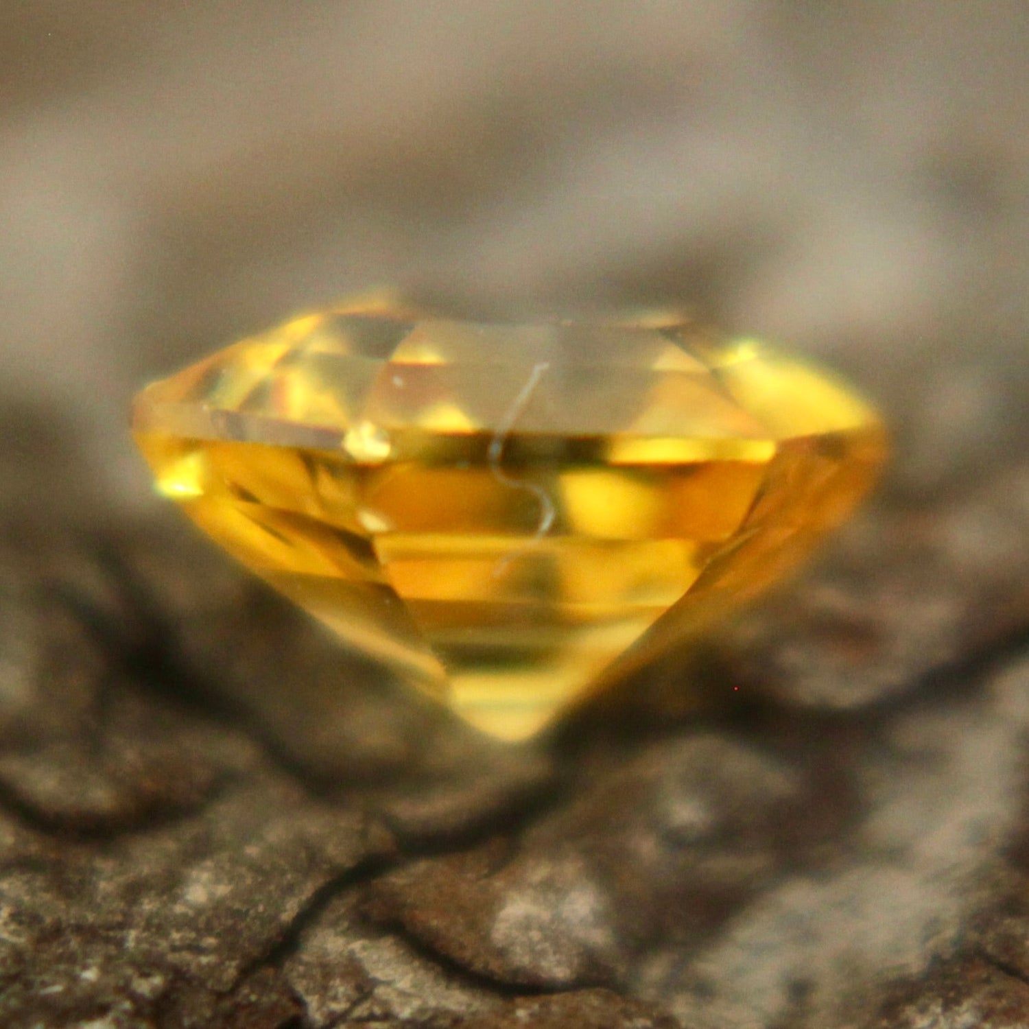 Loose yellow sapphire heated 0.85 carat freeform faceted stone