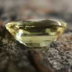 Side profile of unheated cushion yellow sapphire, VS clarity
