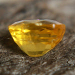 Cushion yellow sapphire with calipers: 7.30 × 5.93 × 4.92 mm