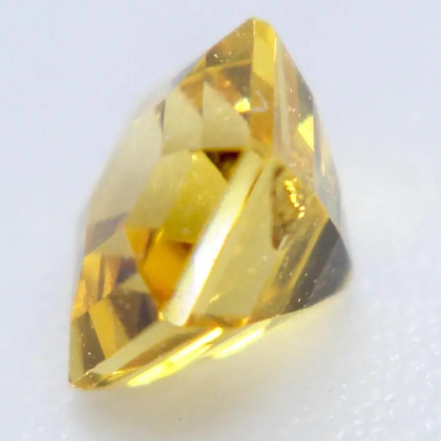 Ceylon yellow sapphire measured on calipers at 3.64 × 3.57 mm