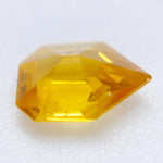 0.60ct Ceylon yellow sapphire, freeform cut, heated, I clarity — macro under daylight