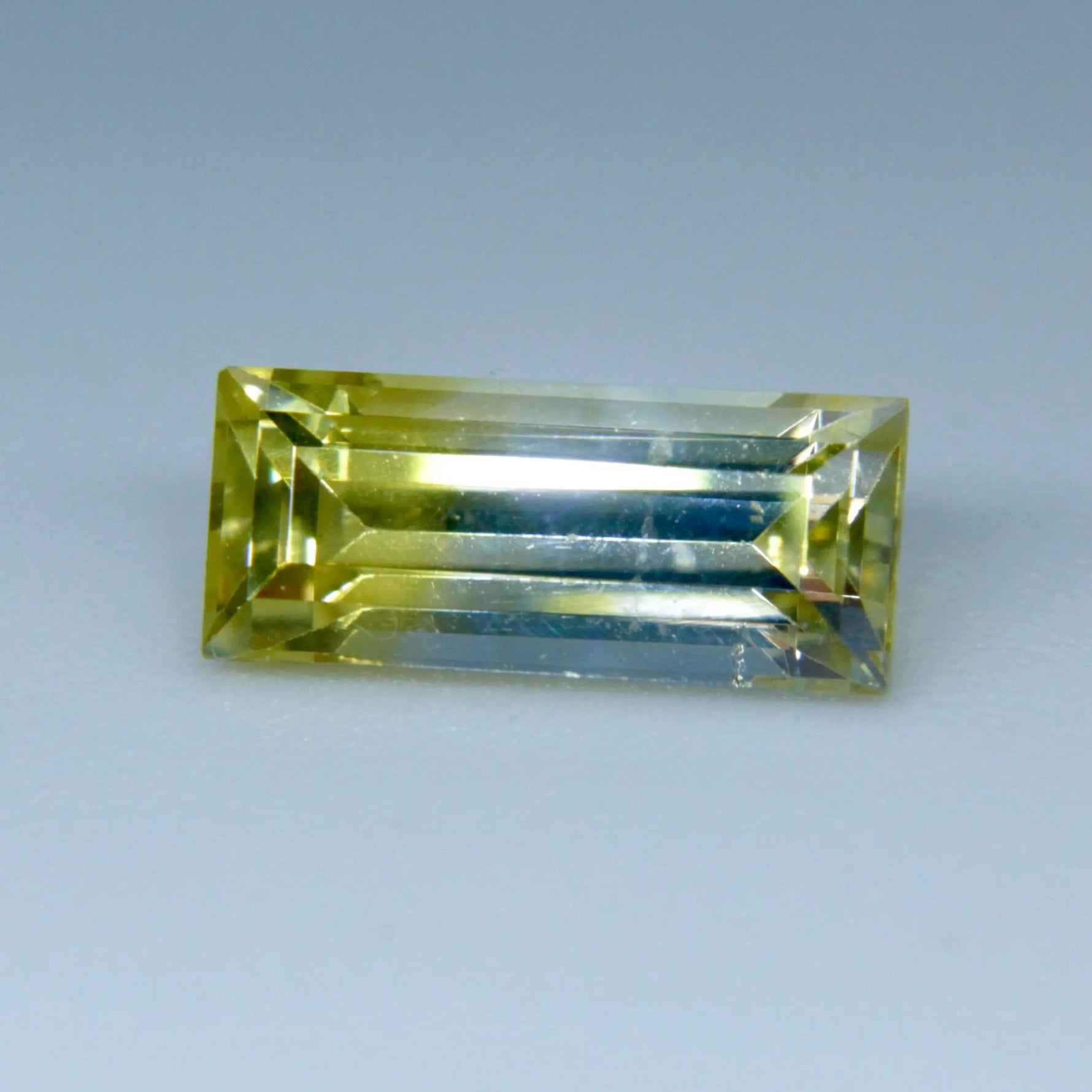 Yellow-white sapphire 1.45ct baguette cut 9.27×3.97×3.54 mm, unheated untreated Ceylon