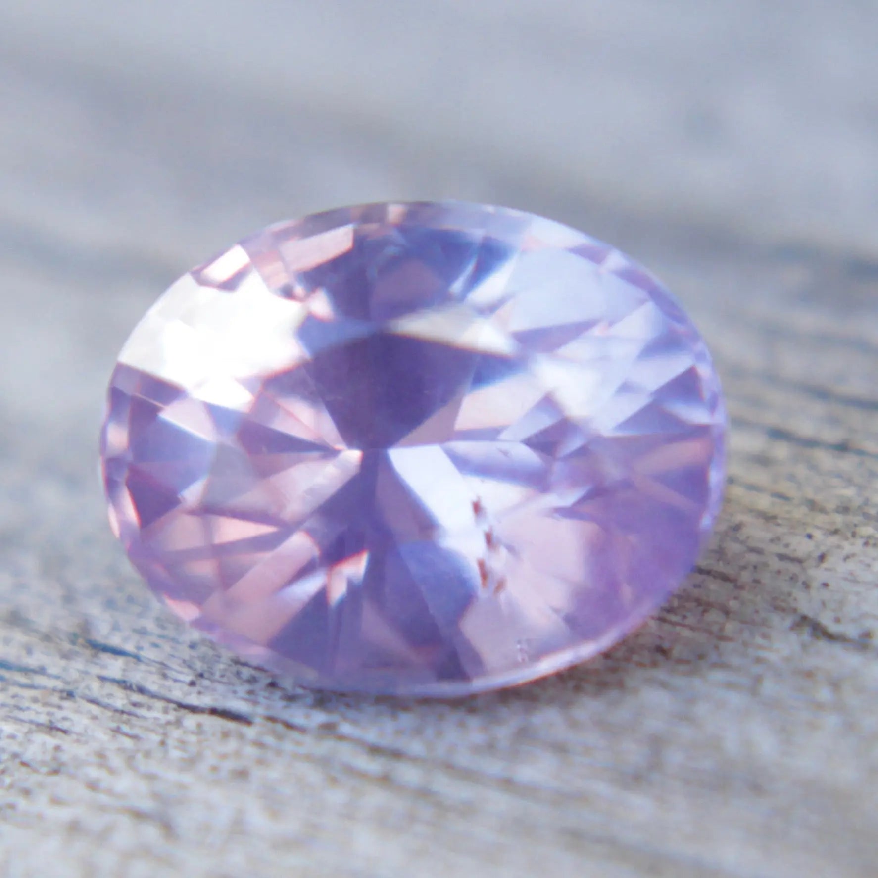 Oval pink-purple sapphire for custom fine jewelry design