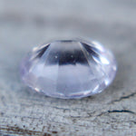 Angled view of a pale purple Ceylon sapphire