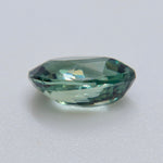 Close-up of the crown facets and pointed tip of a pear-cut natural alexandrite.