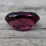 Natural pinkish purple spinel measuring approximately 7.28 by 5.10 mm