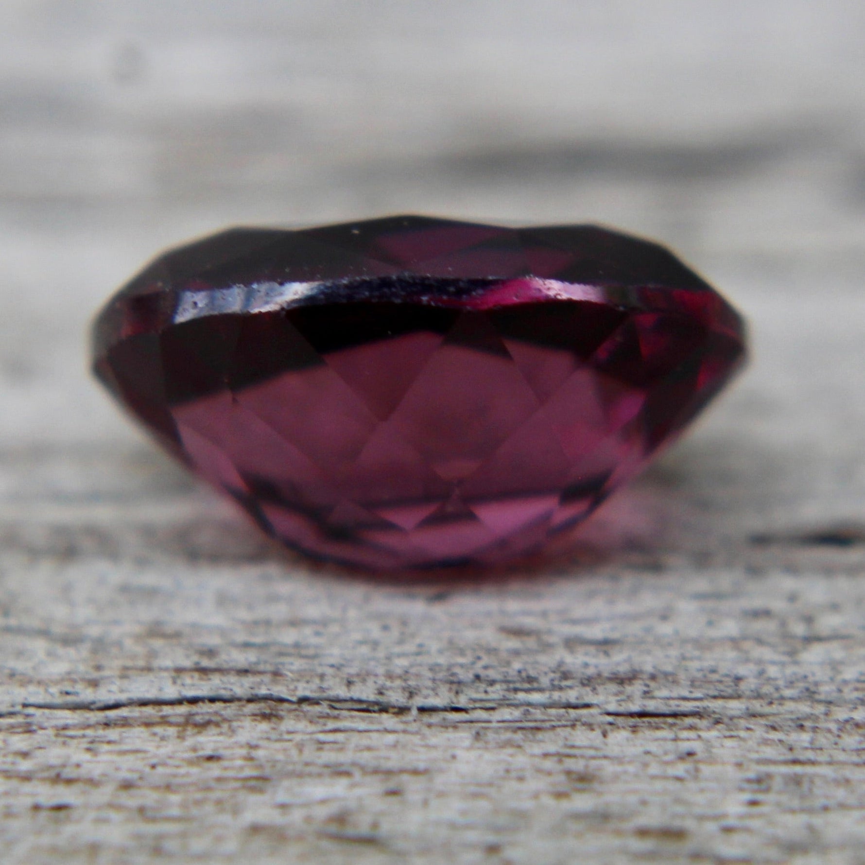 Natural pinkish purple spinel measuring approximately 7.28 by 5.10 mm