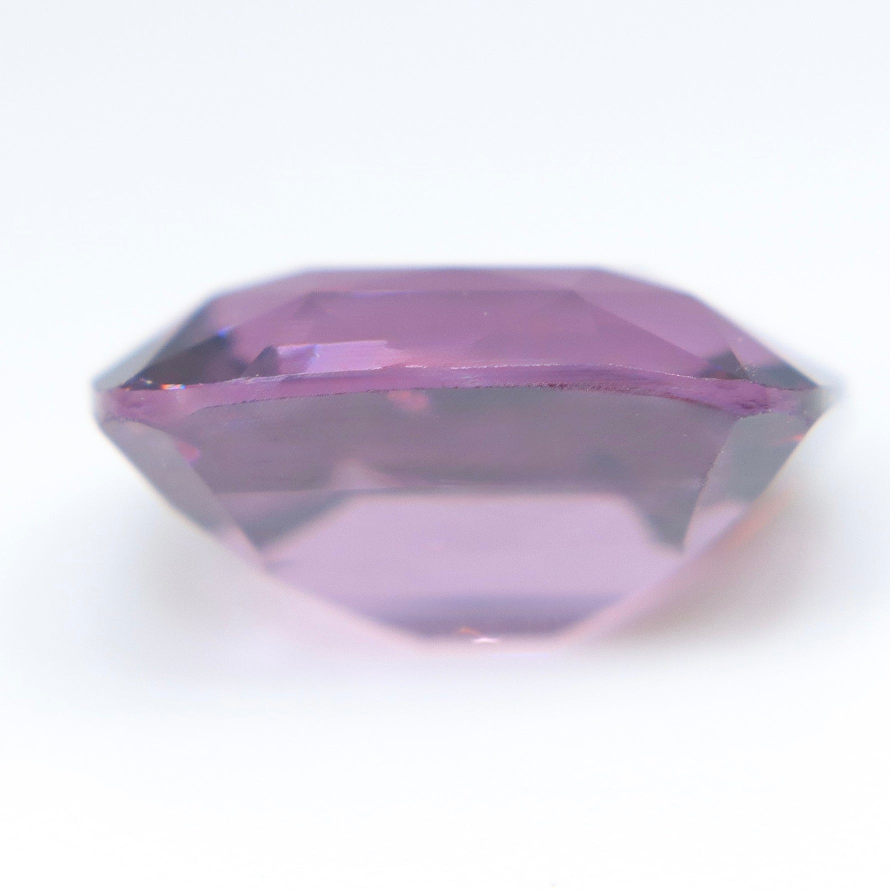 Pinkish purple cushion-cut spinel measuring 8.86 by 7.47 mm