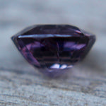 Natural purple spinel measuring 6.90 by 6.30 mm front view