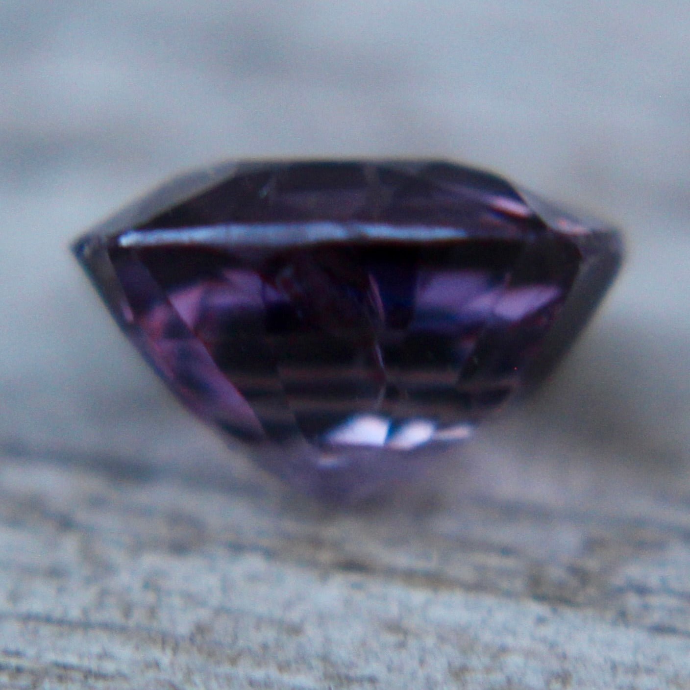 Natural purple spinel measuring 6.90 by 6.30 mm front view