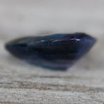 Side profile of 1.40 ct pear-cut purple spinel showing 3.20 mm depth