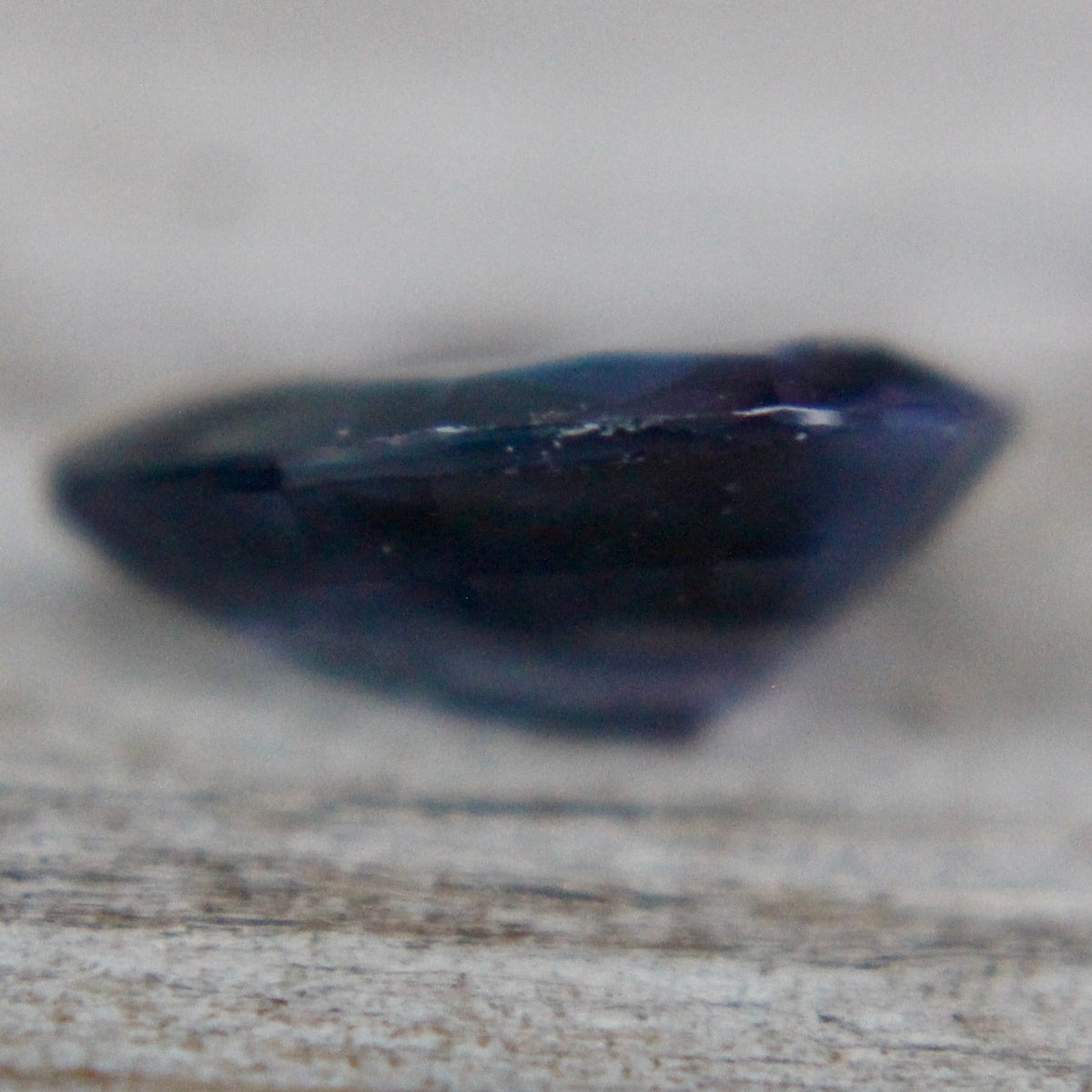 Side profile of 1.40 ct pear-cut purple spinel showing 3.20 mm depth