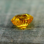 Side profile of 1.23 ct round yellow Ceylon sapphire