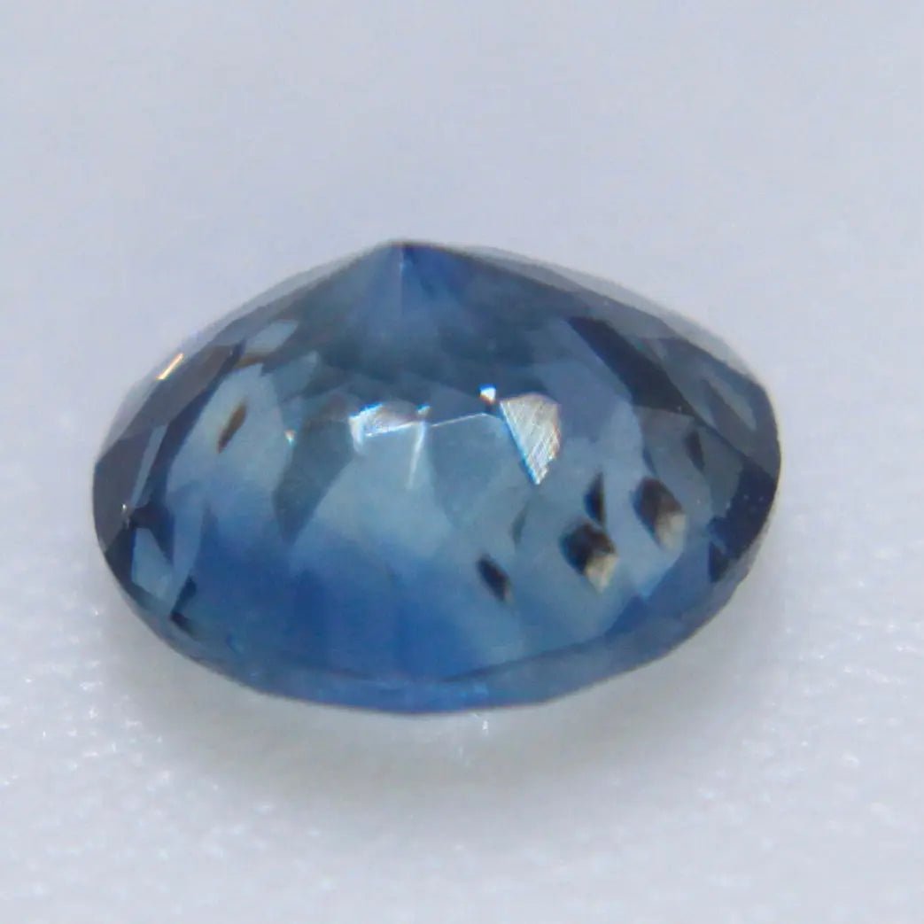 Angled view of a natural teal sapphire from Madagascar