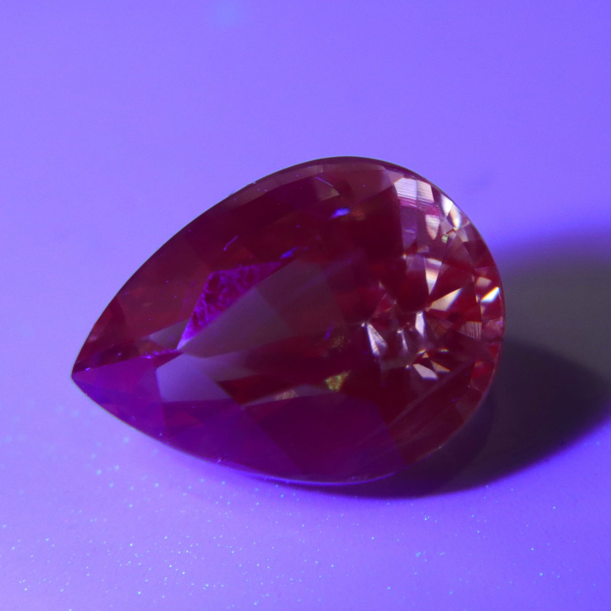 Unheated pear-cut alexandrite displaying green tones under daylight-style lighting