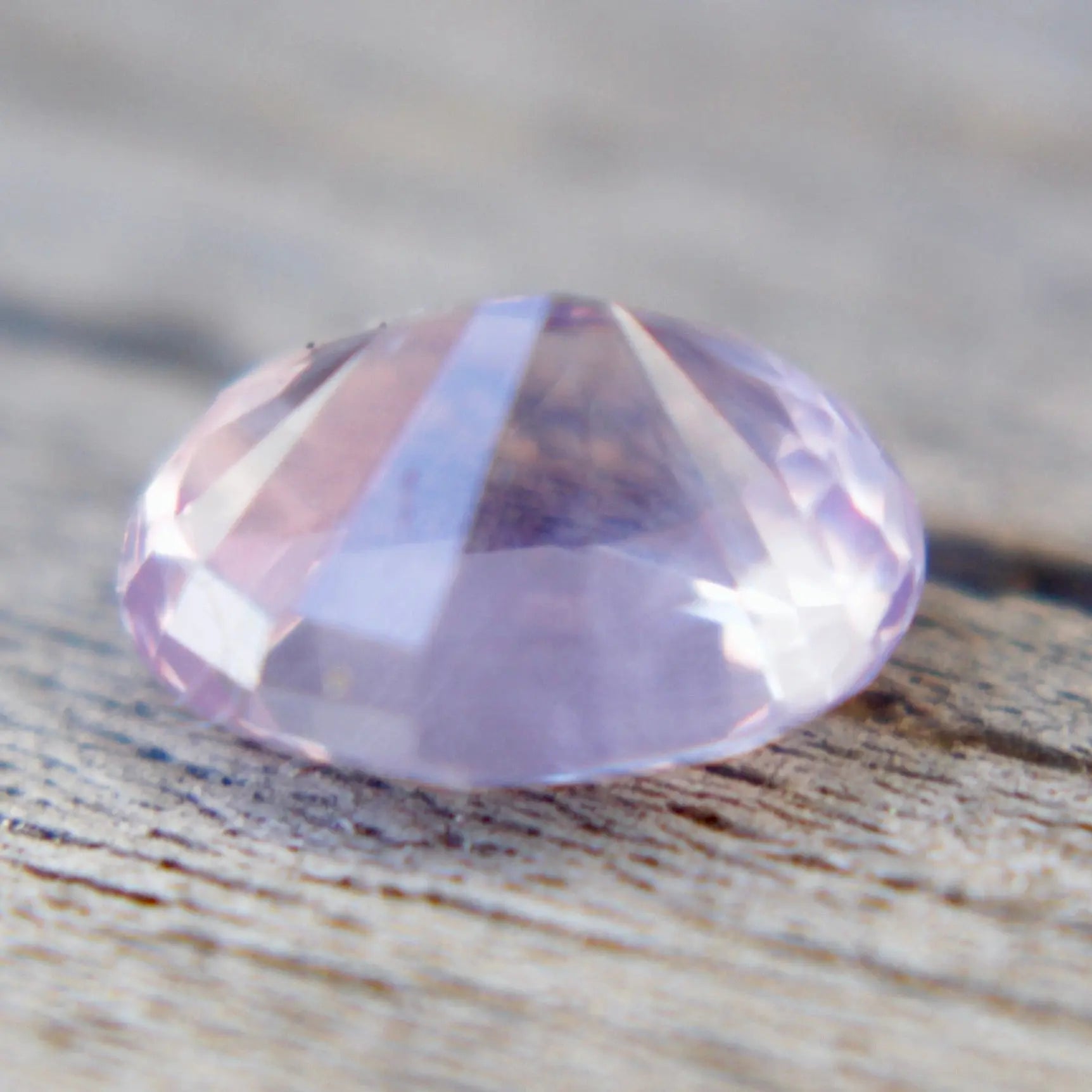 Unheated Ceylon pink sapphire measuring 6.35 by 5.02 mm