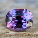 Unheated violet-purple Ceylon sapphire photographed in natural light
