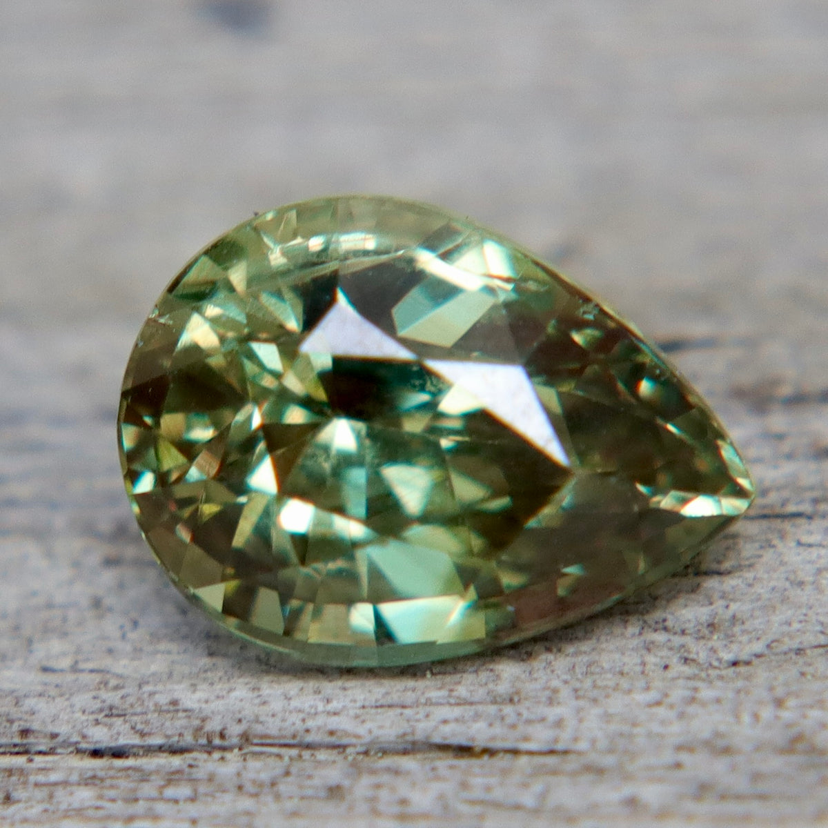 Side view of an untreated Ceylon alexandrite showing its pear-cut profile and depth