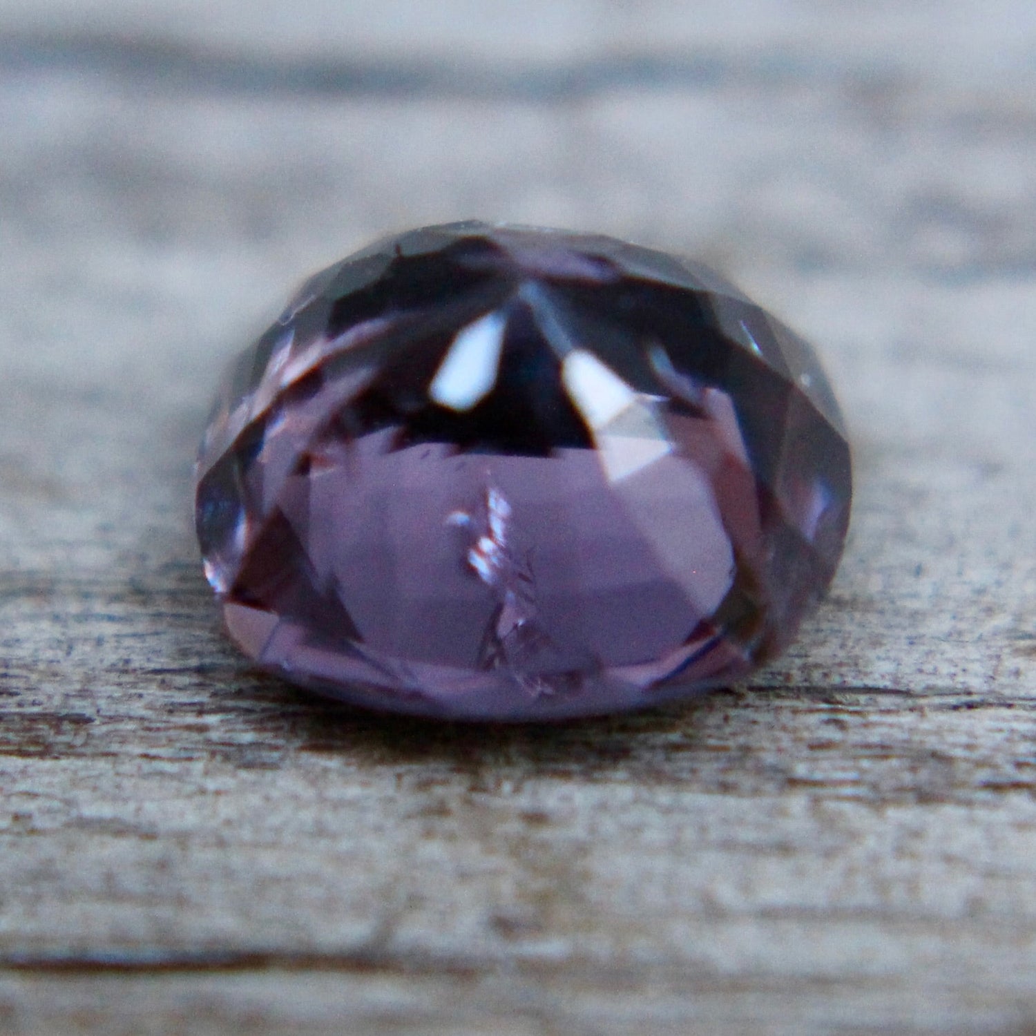 Untreated Ceylon purple spinel cushion-cut loose gemstone close-up