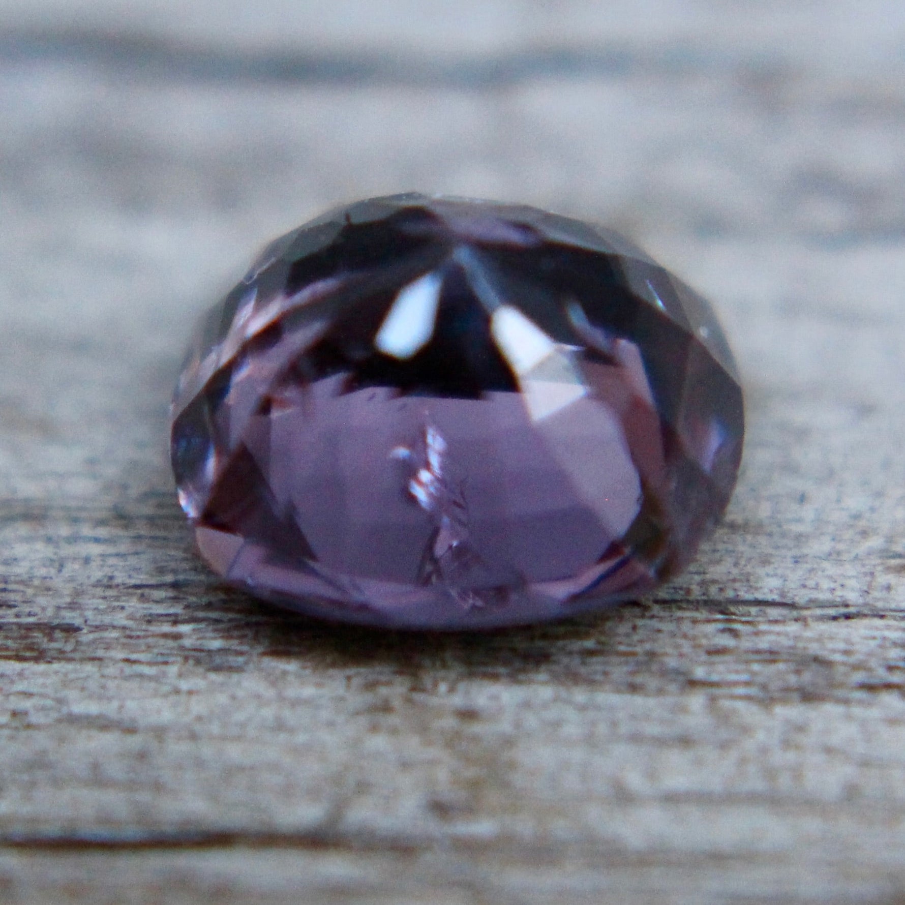 Untreated Ceylon purple spinel cushion-cut loose gemstone close-up