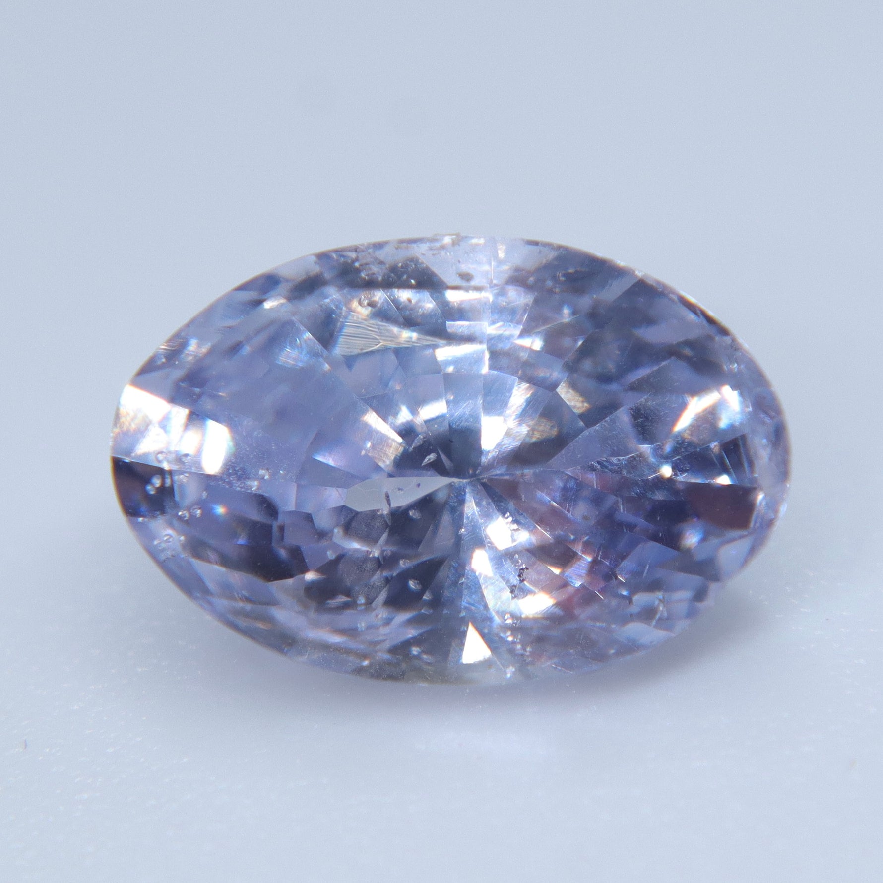 Untreated oval purple sapphire showing its natural included clarity