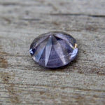 Face-up view of untreated 0.89 carat round purple spinel gemstone