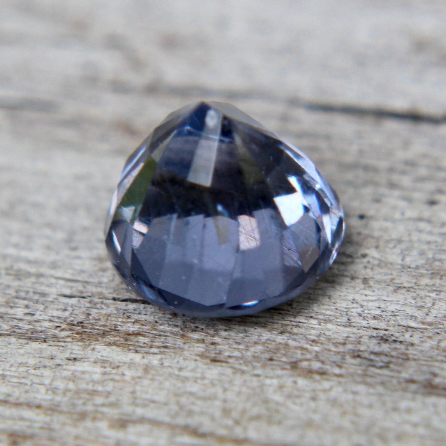 Face-up view of untreated 1.50 carat round purple spinel gemstone