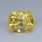 Loose vivid yellow sapphire measuring approximately 6.42 by 5.31 mm