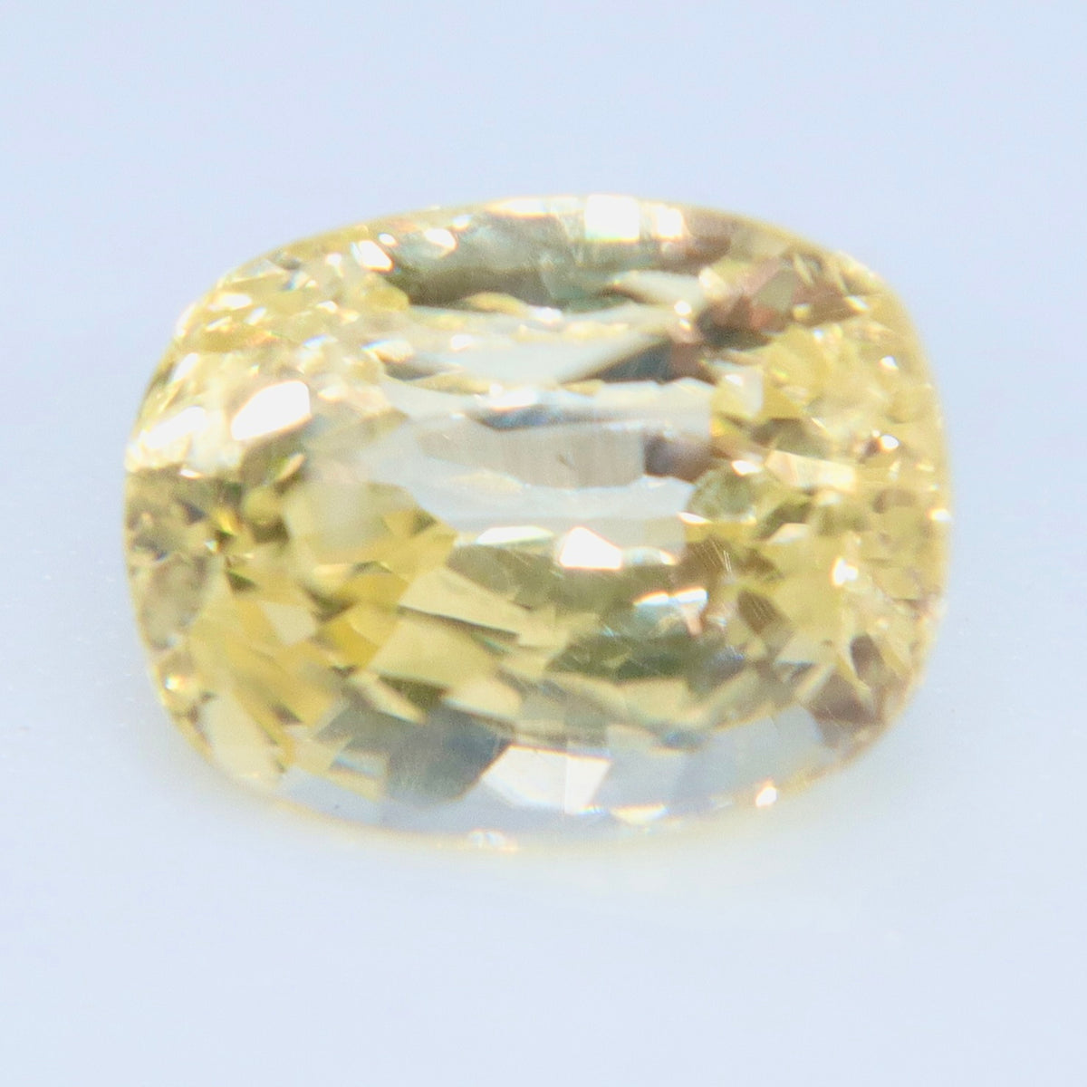 Yellow sapphire viewed from above, showing its rectangular outline and rounded corners