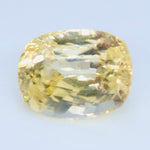 Close-up of the yellow cushion sapphire showing reflections and fine internal details