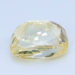 Underside view of the yellow cushion sapphire showing its pavilion facets