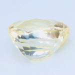 Side profile of the yellow sapphire showing its crown, girdle, and pavilion
