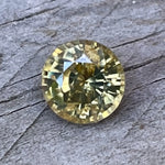 Eye-clean greenish yellow round zircon from Sapphire Pal