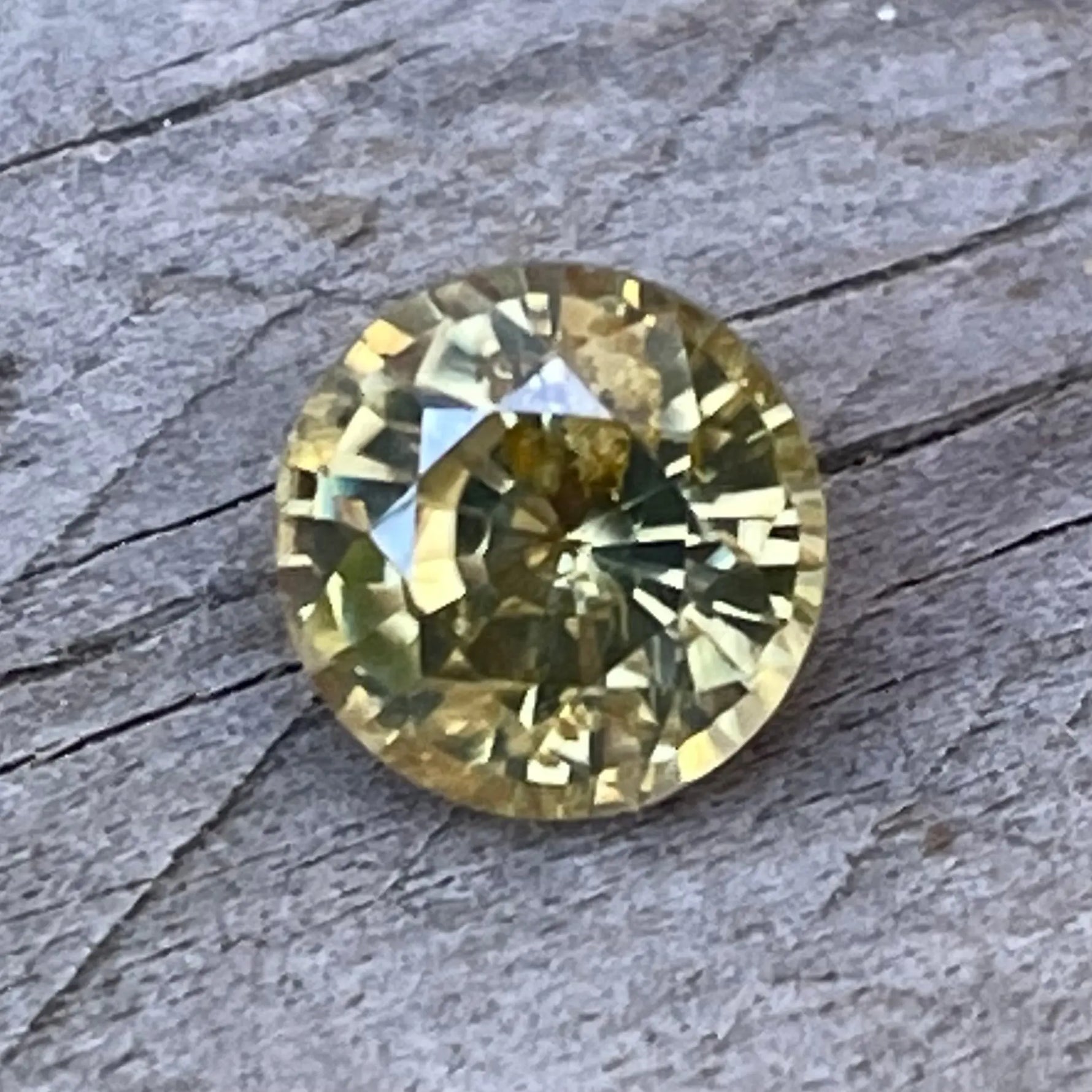 Eye-clean greenish yellow round zircon from Sapphire Pal