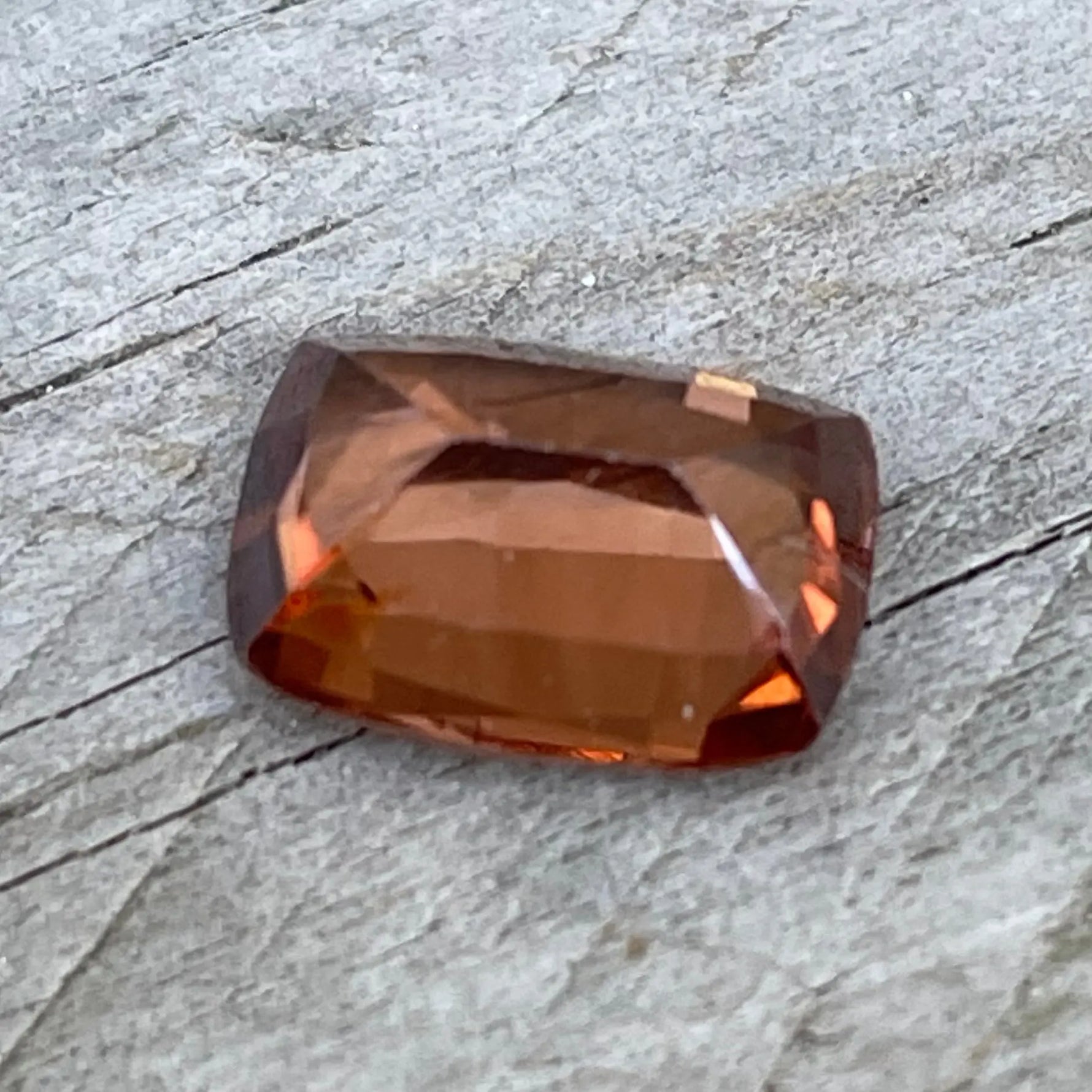 Loose brown zircon measuring 9.53 by 6.90 mm