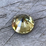 Round cut greenish yellow zircon loose gemstone