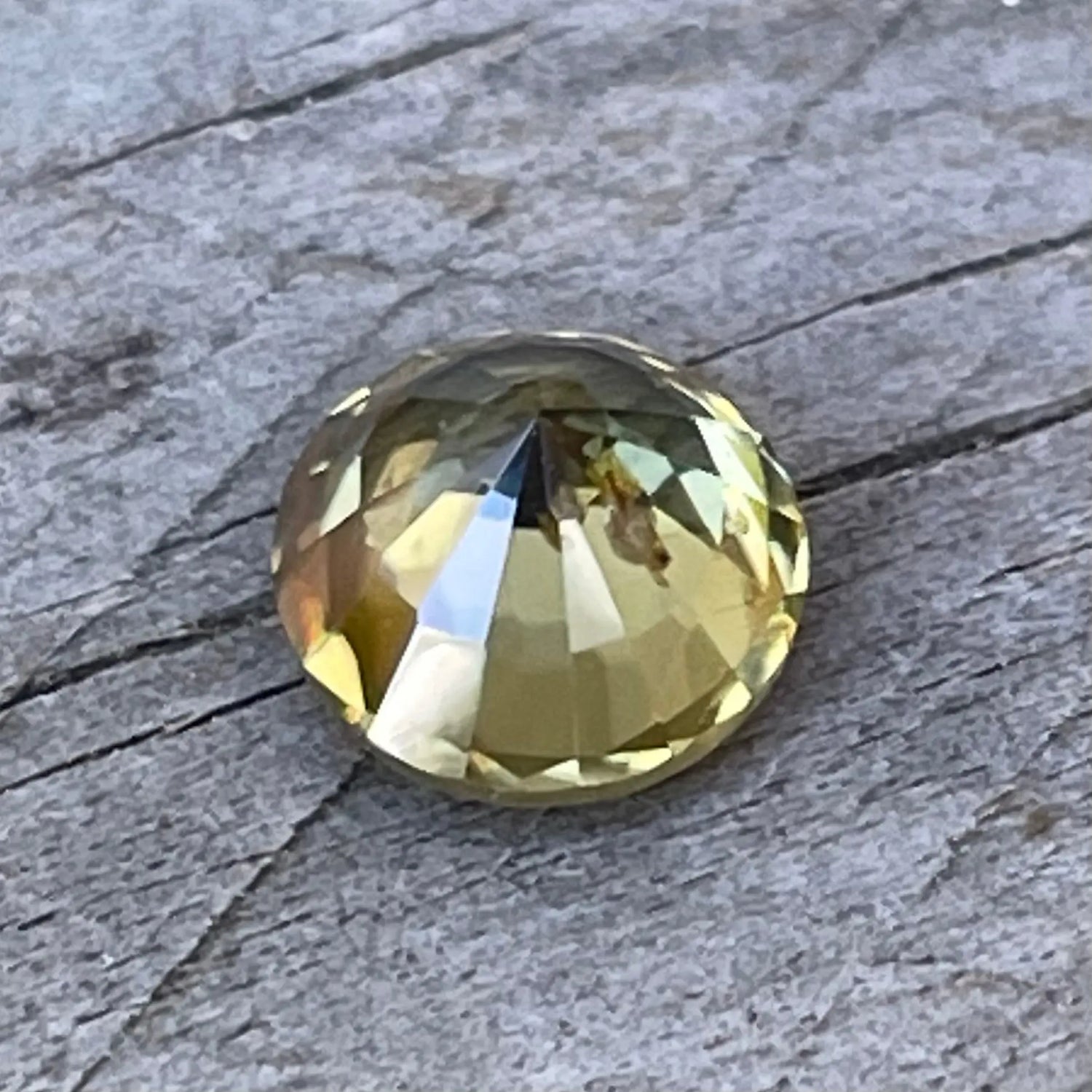 Round cut greenish yellow zircon loose gemstone