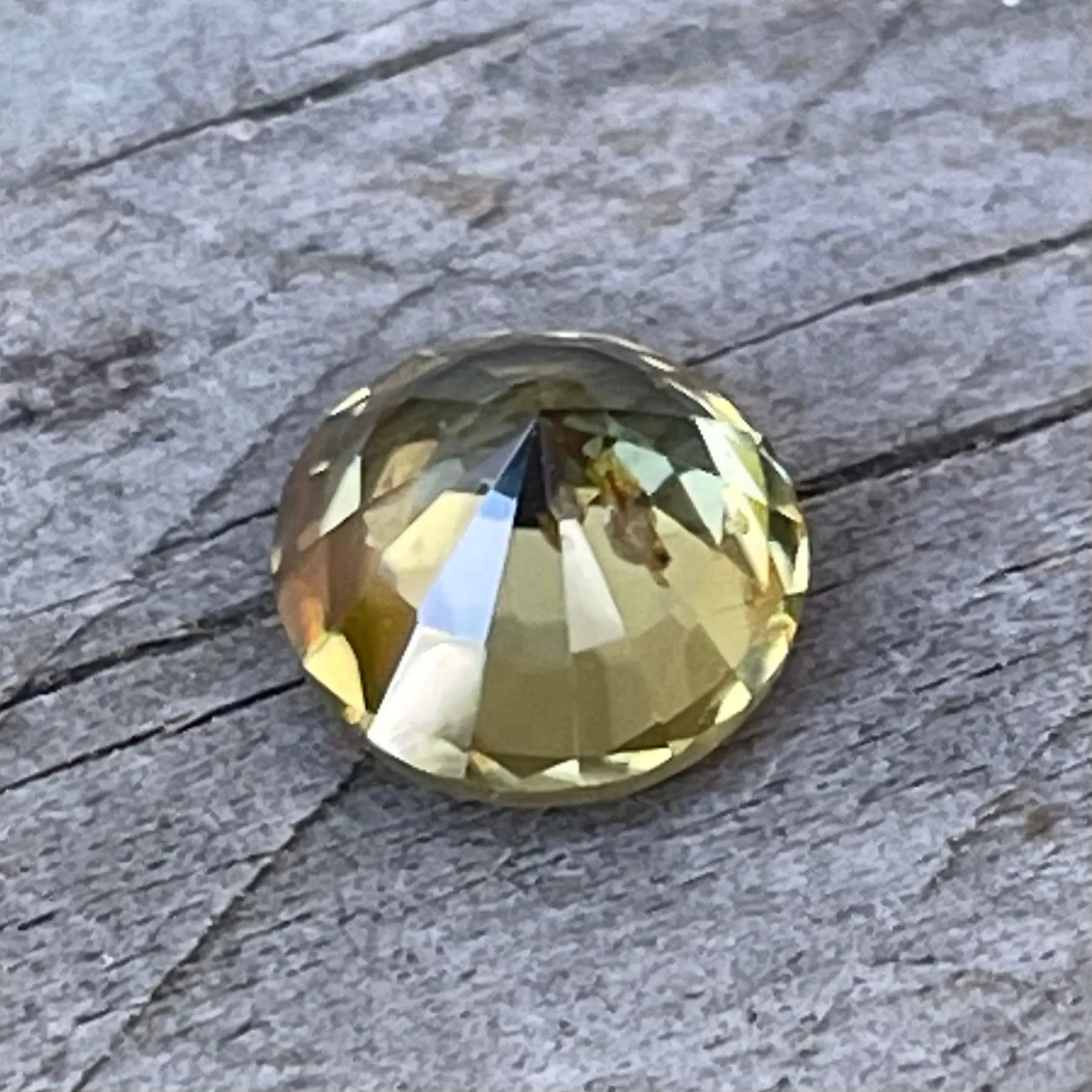 Round cut greenish yellow zircon loose gemstone